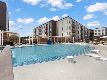 Outdoor cabanas by pool at the arza apartments